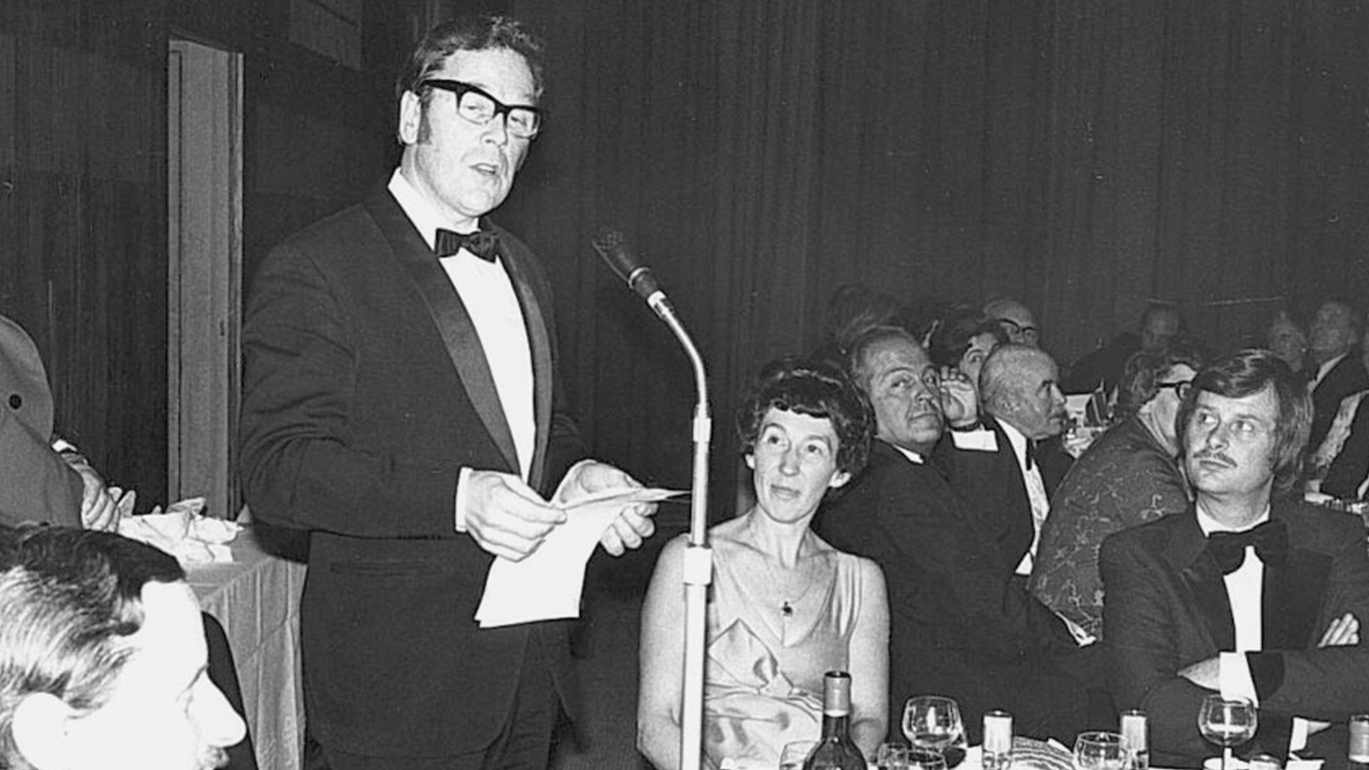 Laurie Foster welcomes guests at the Annual Dinner in 1976